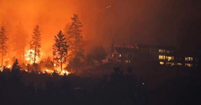 Mass evacuations in Canada province where 380 wildfires burn